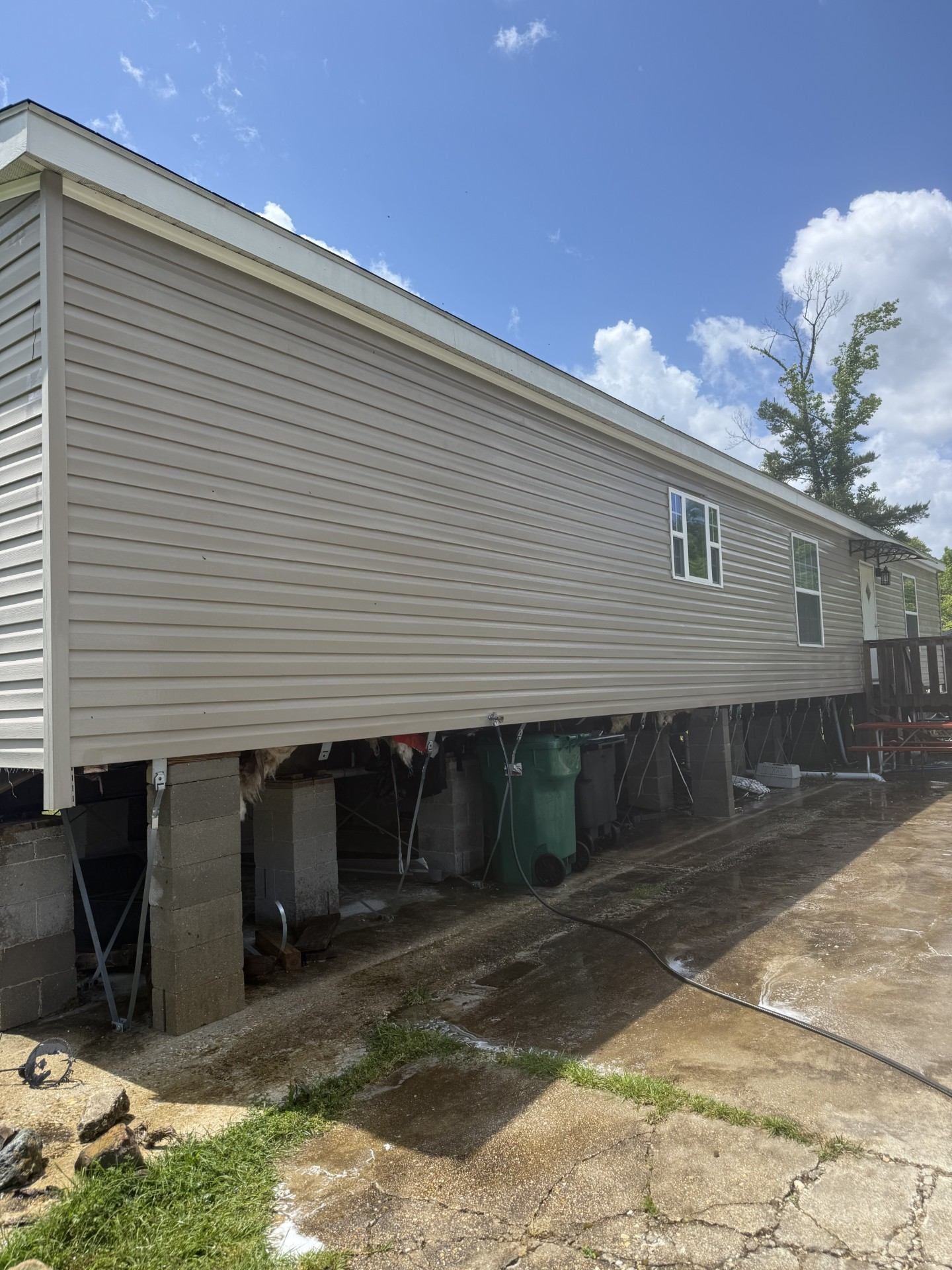 Mobile home exterior after soft wash — clean vinyl siding